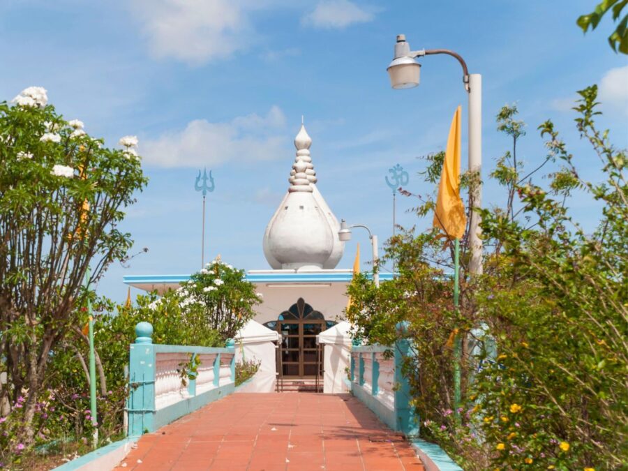 Photo of the entrance to a Hindu temple taken from the road.